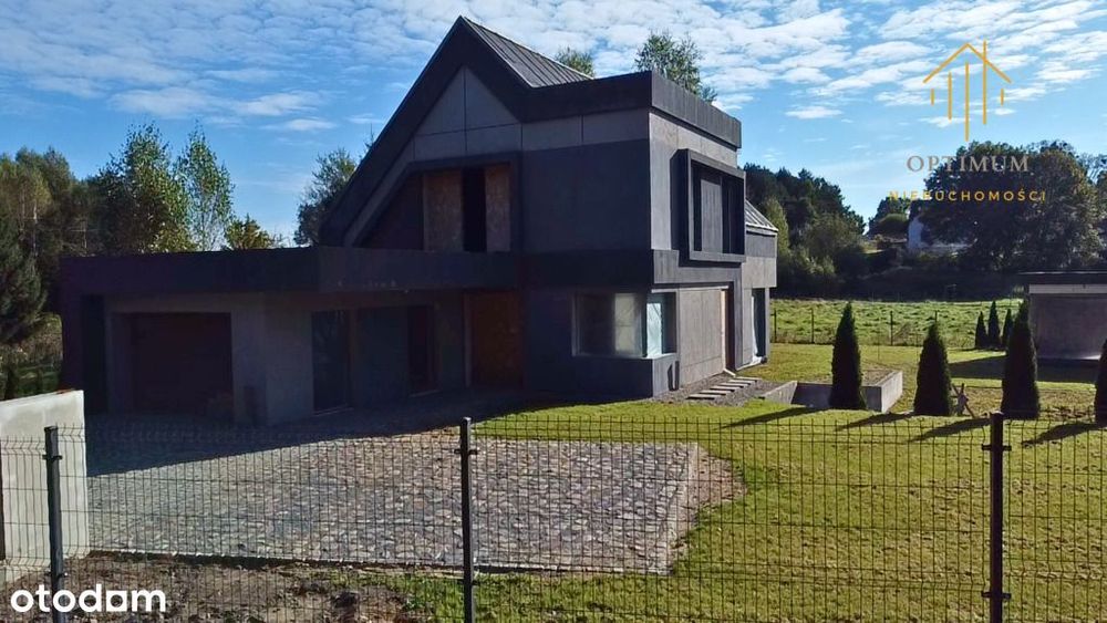 Dom z garażem na zagospodarowanej działce – Woryty