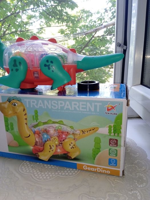 Динозавр,танцює,шестерні звук,світло 2 кольори