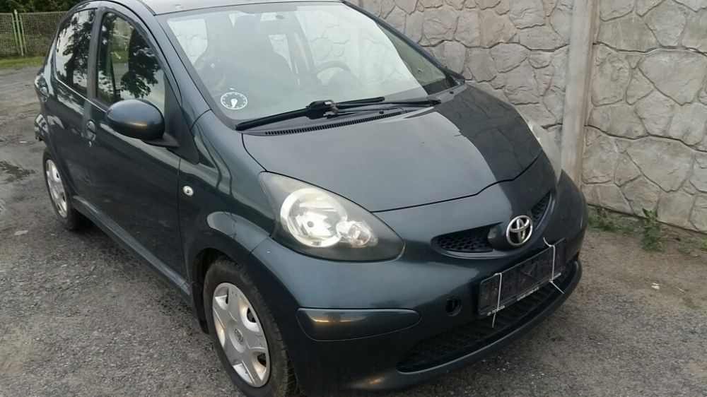 Na części Toyota Aygo 1E0 Silnik Skrzynia Maska Zderzak Drzwi Klapa Szyba