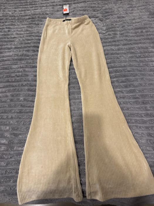 Продам нові кльошні штани в смужку !