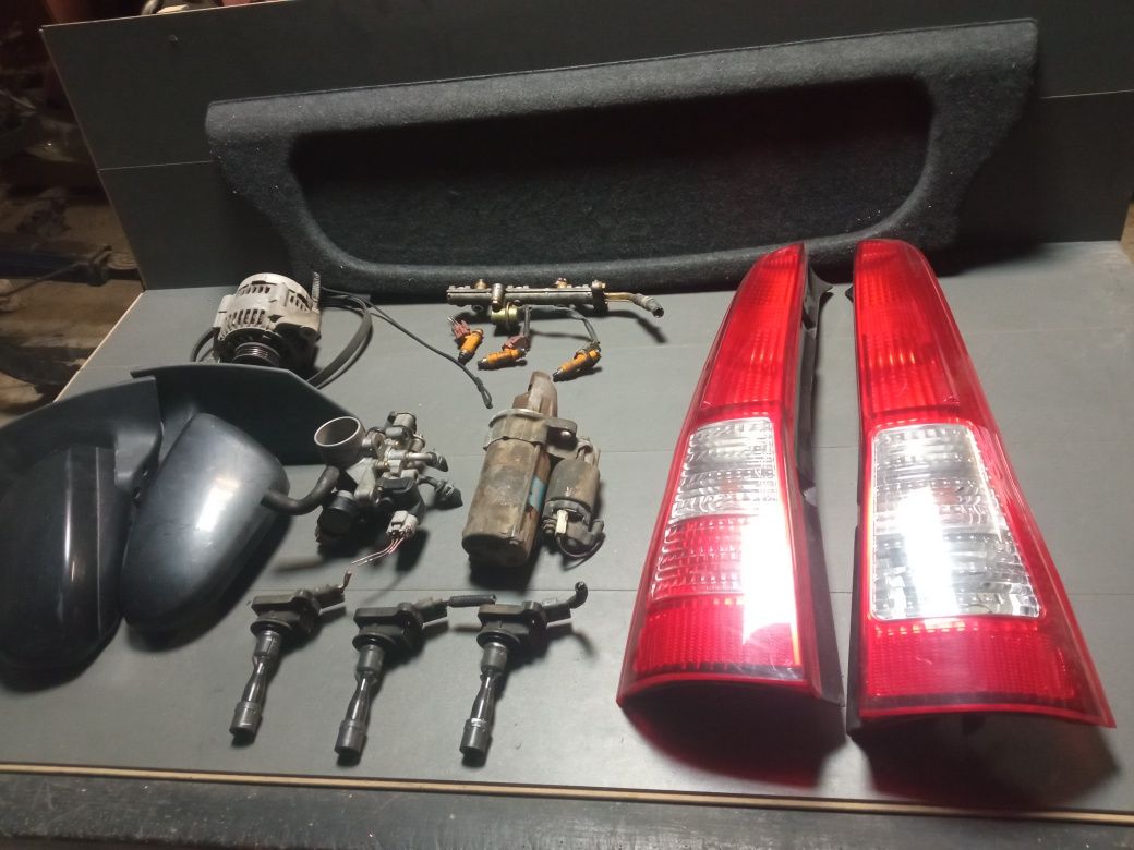Daihatsu cuore II alternator rozrusznik lampy lusterka cewki wtryski