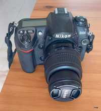 Nikon D200, objetiva, flash, carregador bateria e bateria,  tripé.