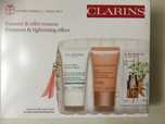 Подарок Clarins: маска, крем, сыворотка для глаз, косметичка 40 % цены