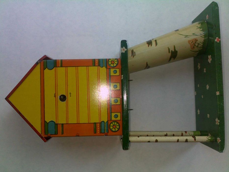 Детская жестяная заводная игрушка с ключиком ссср часы часики птичка