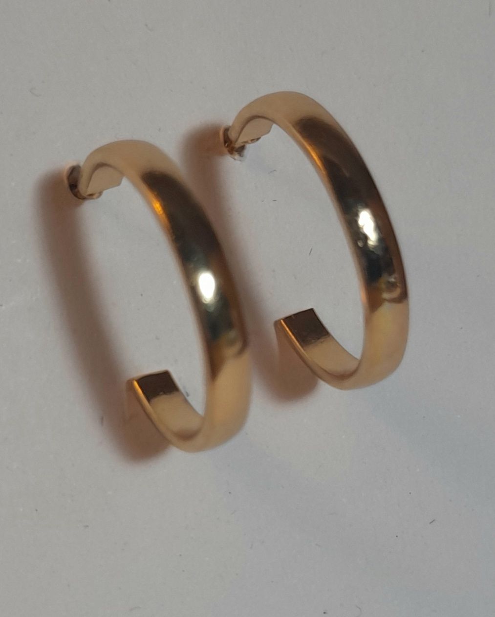 Gold hoop with spike.