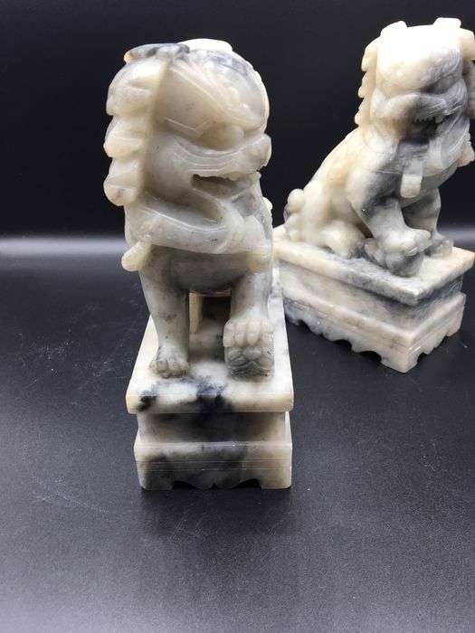 Caes foo orientais em pedra