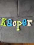 Literki, imię Kacper.