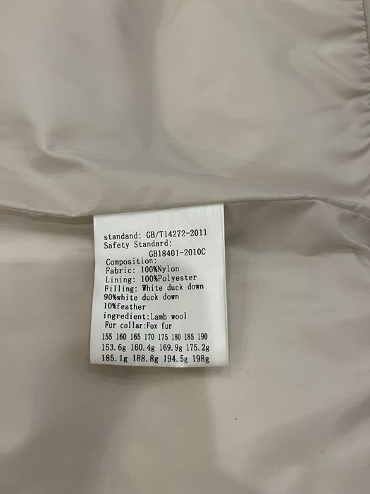 Пухова куртка з натуральним хутром