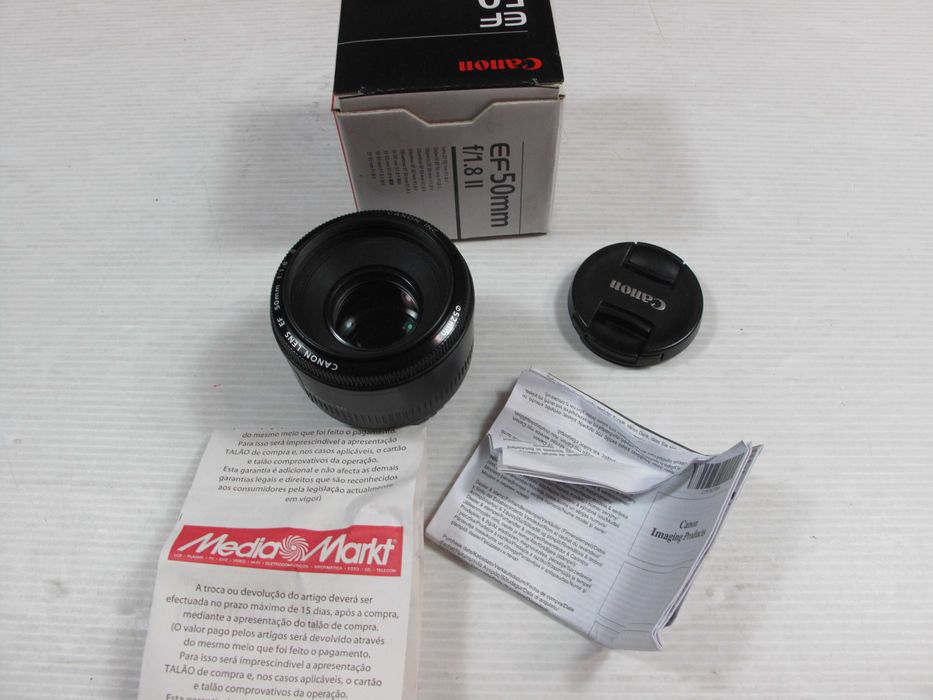 Canon  50mm 1.8 II ou STM, ou ainda a 24mm 2.8-Ver descrição