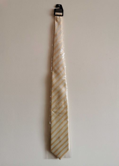 Kremowo-żółty krawat w paski
