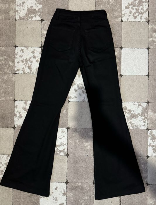 Джинси чорні кльош