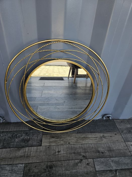 Złote lustro okrągła rama