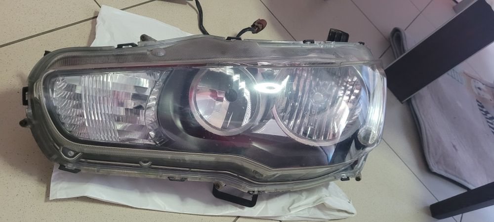 Фара передня ліва оригінал Lancer 2008 8301B259