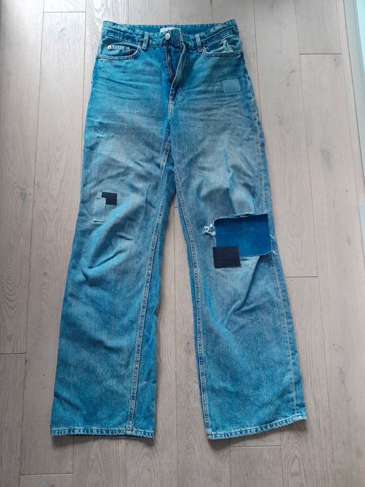 Niebieskie szerokie spodnie h&m 38 M next wysoki stan z dziurami