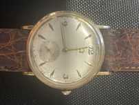 Мужские коллекционные золотые часы Omega