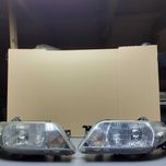 Lampy przednie Mazda 323F