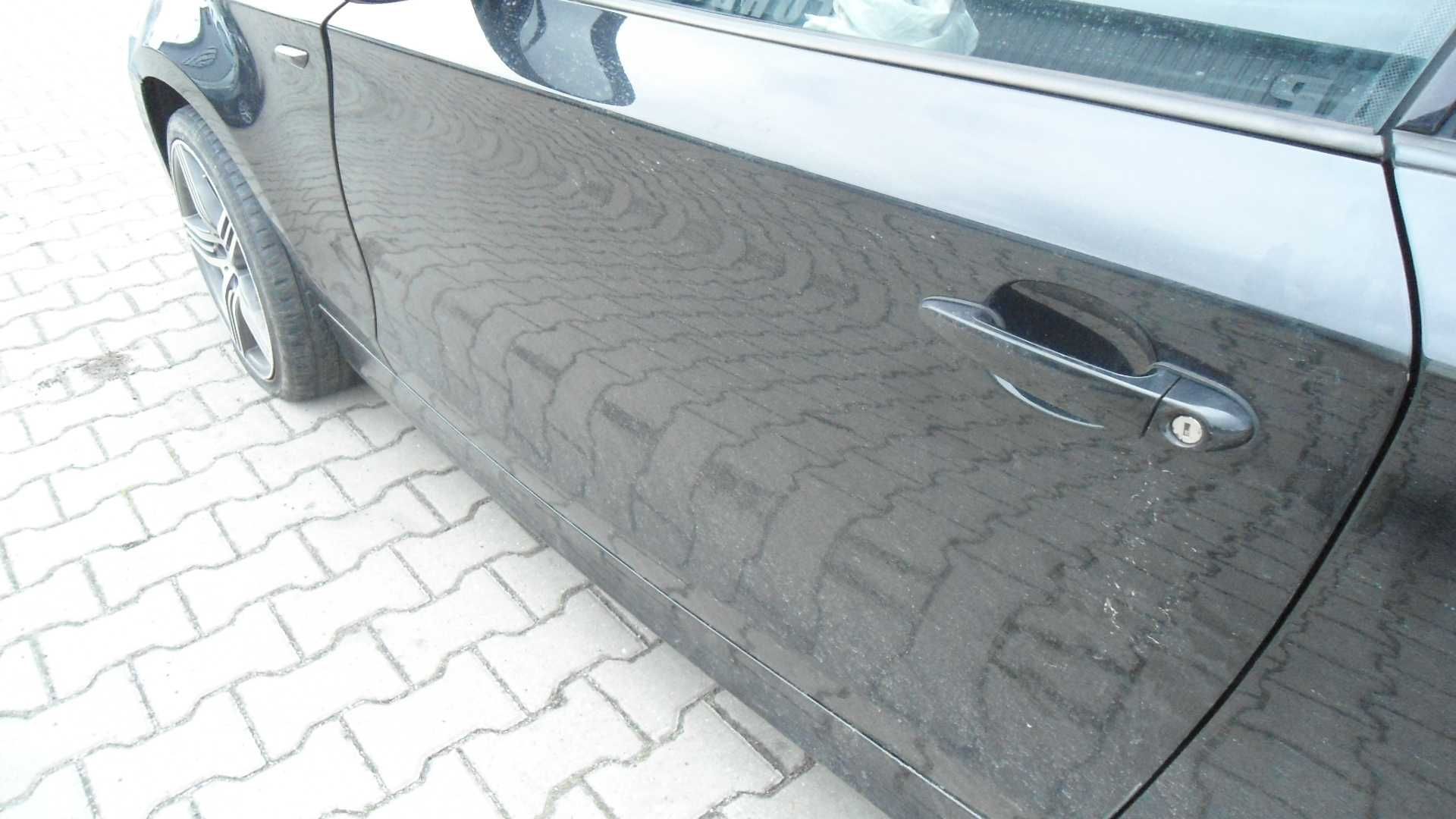 Drzwi Lewe BMW E81 lakier Black Sapphire Metalic 2009r