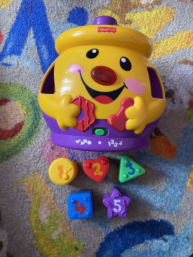 Garnuszek Fisher Price