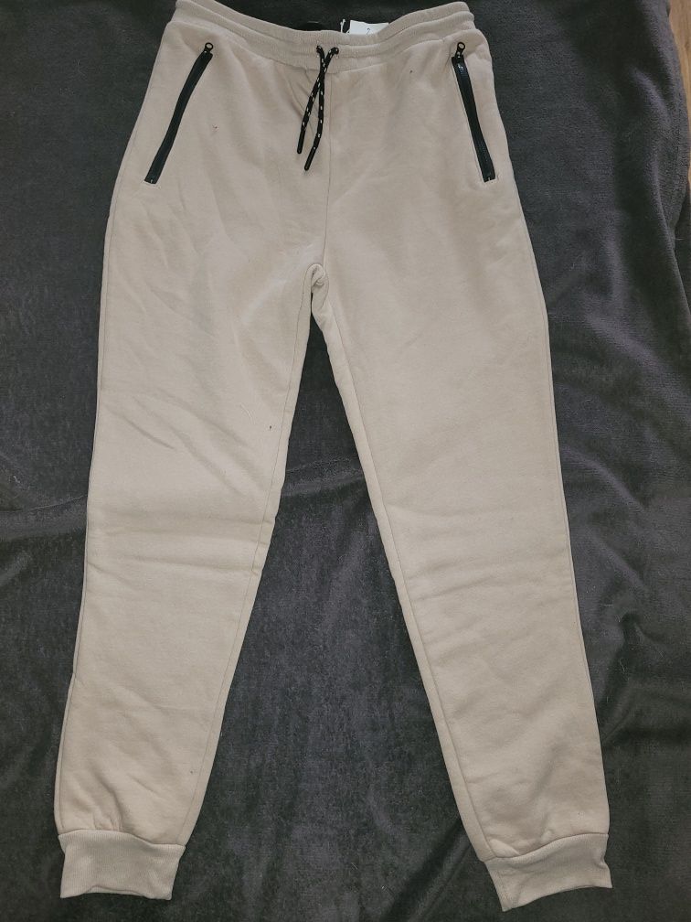 Reserved spodnie dresowe joggersy beżowe r.170