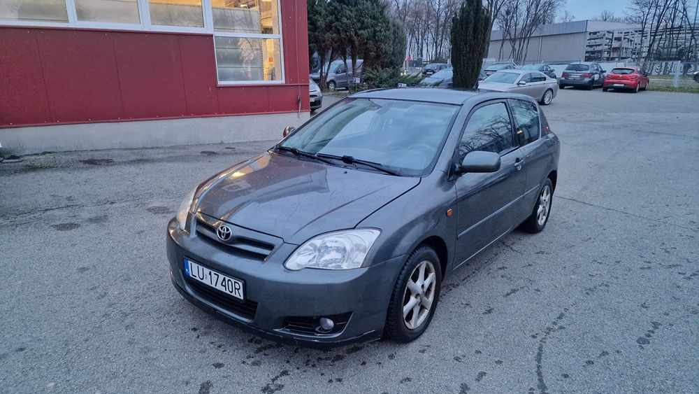 Toyota corolla e12 lift  1c3 lampa zderzak przód maska pas