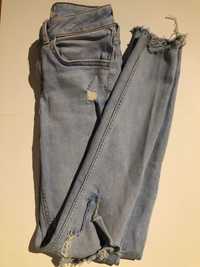 Jasne jeansy z dziurami na kolanach rozm. 146