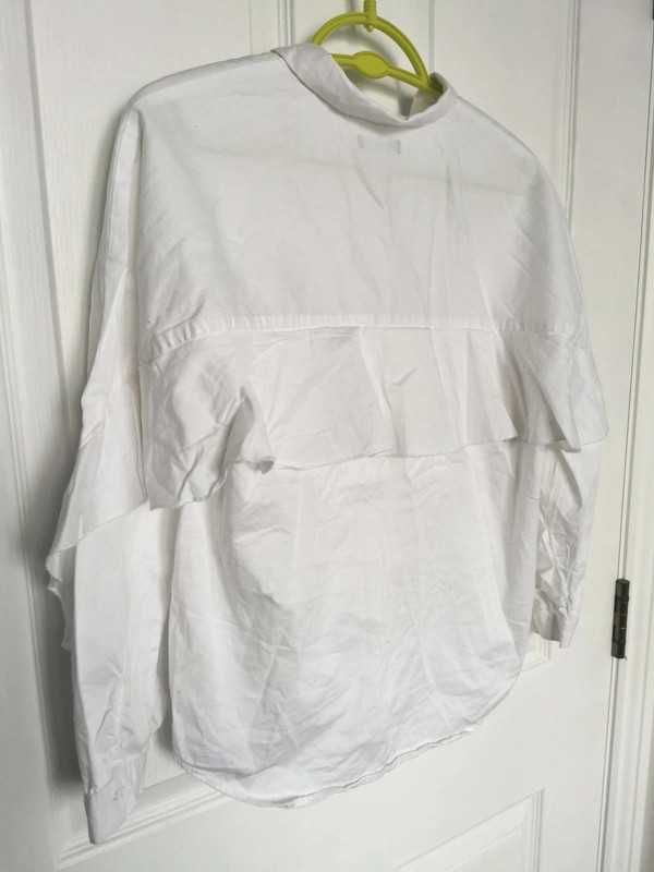 Biała koszula z falbanką Reservet r. 152 cm