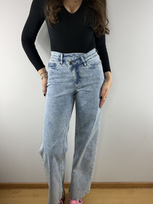 Niebieskie asymetryczne jeansy dżinsy z szeroką nogawką Bonprix 36