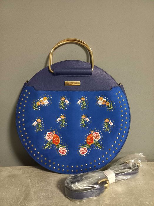 Жіноча сумка з металевими ручками