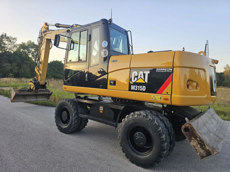 Caterpillar M315D  Koparka kołowa / 9570 MTG / Verachtert / Skarpówka /15.9t(313,316,318)