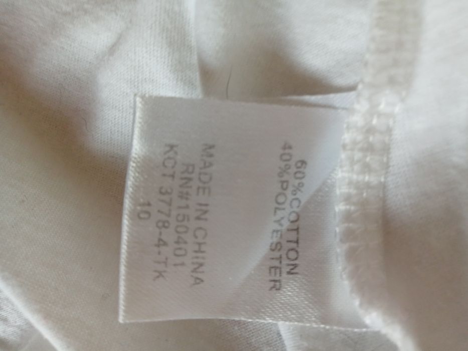 Biała bluzeczka z długim rękawem na 10 lat