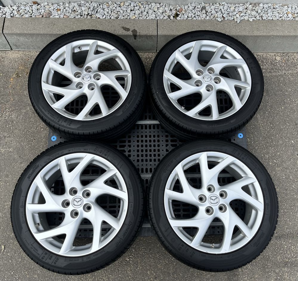 Komplet kół 18” Mazda – felgi aluminiowe + prawie nowe opony Kleber