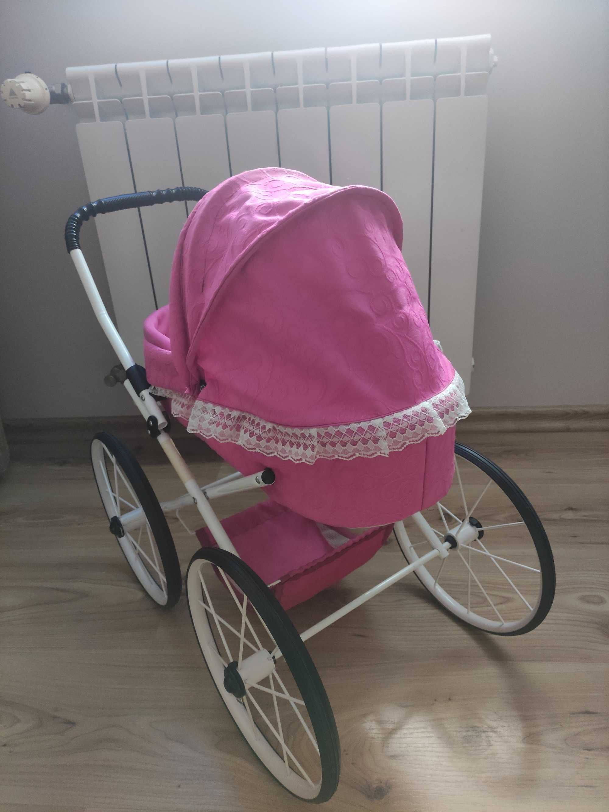 Różowy wózek dla lalek