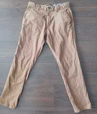 Długie bawełniane spodnie męskie NEXT 30 (S/M) slim fit / musztardowe