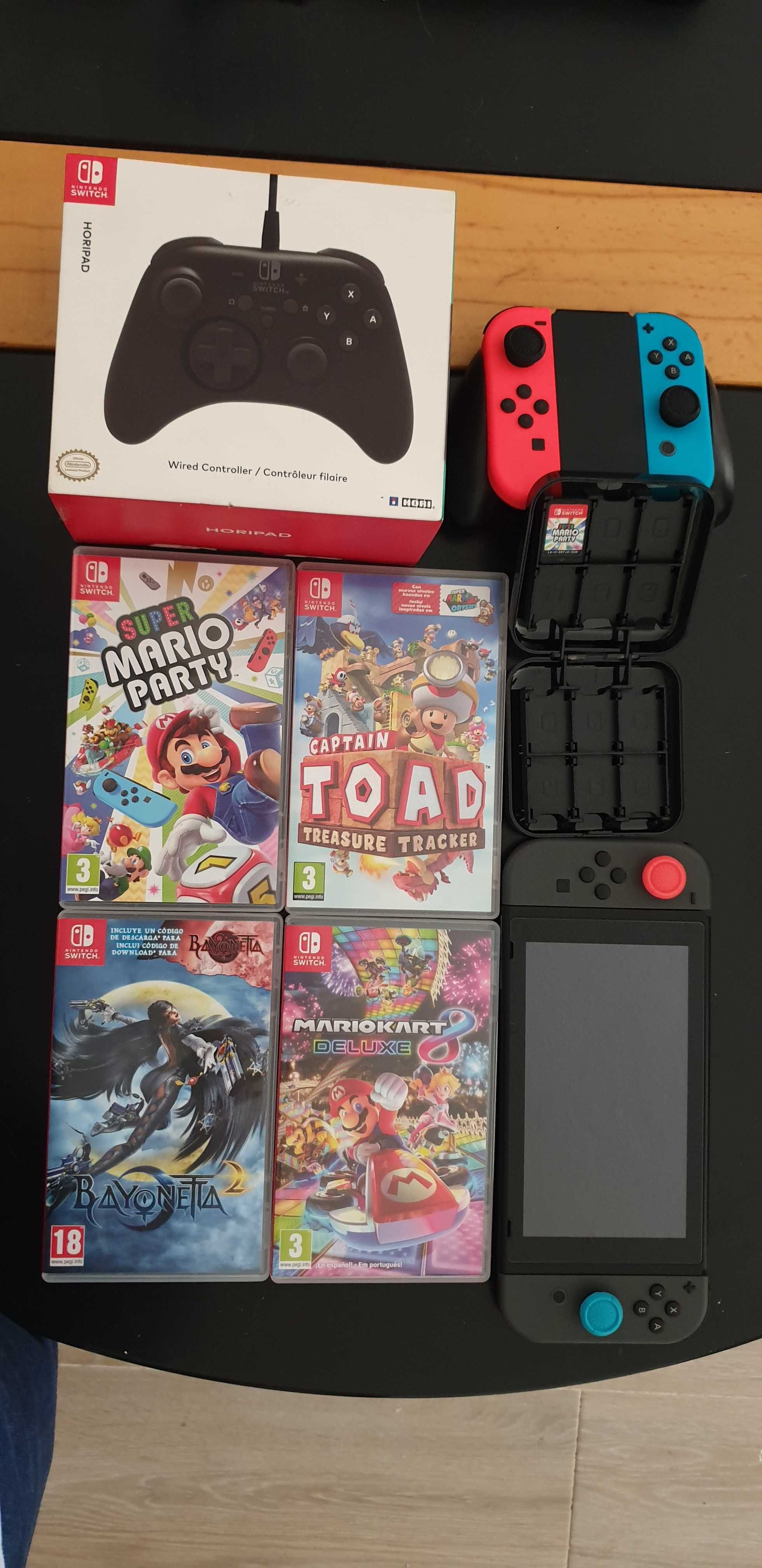 Nintendo Switch + Joycon extra + Comando Horipad com fio + 4 jogos