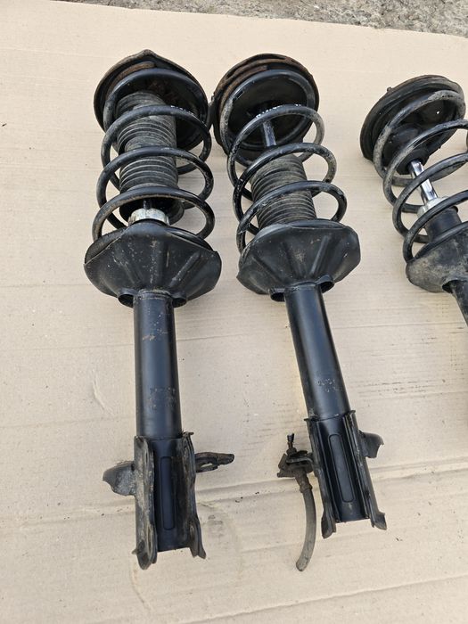 Стойки в сборе Nissan Sunny N14 91-96 левая правая передняя задняя