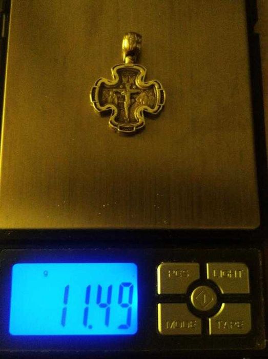 Двосторонній срібний хрестик з храму.