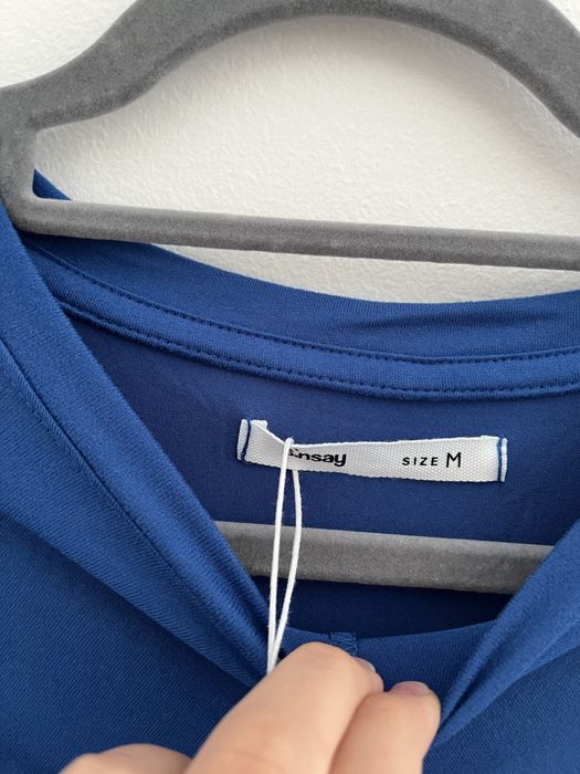 nowa niebieska krótka sukienka z długim rękawem