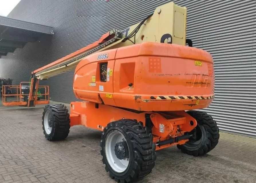 JLG 860 podnośnik teleskopowy 28 m wys robocza Genie S-85