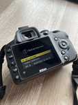 Set of Nikon D3200 photo camera with cable, charger, memory card, etc