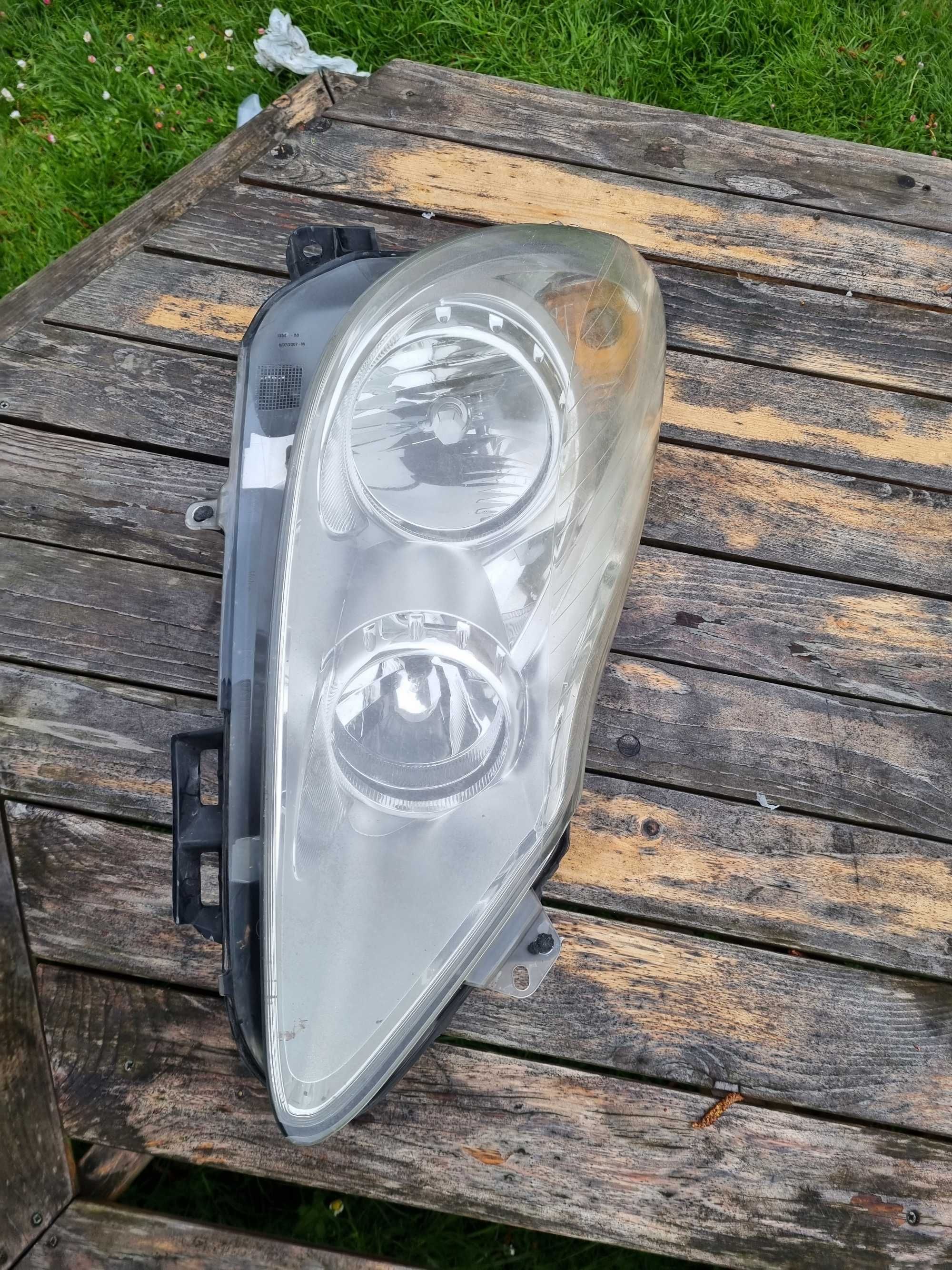 OPEL CORSA D przed LIFT (06-11)- LAMPA przednia przód PRAWA oryginał