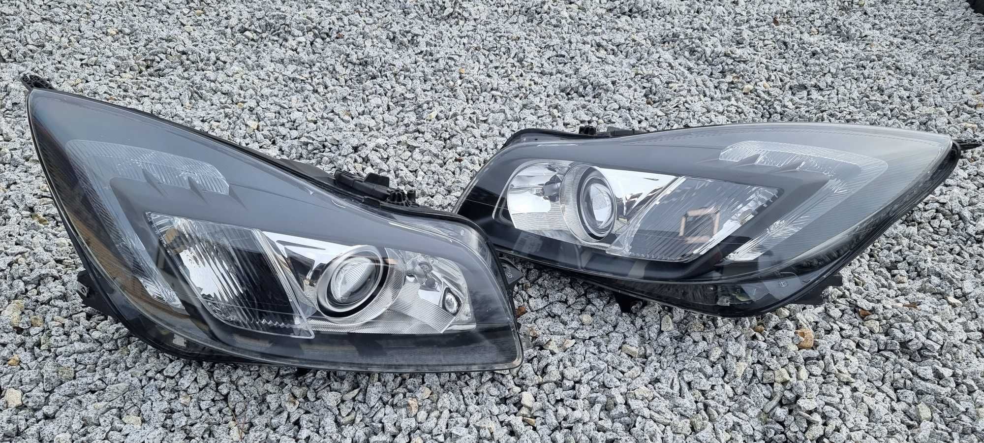 Lampy bi xenon Opel Insignia A skrętne regenerowane reflektory HELLA