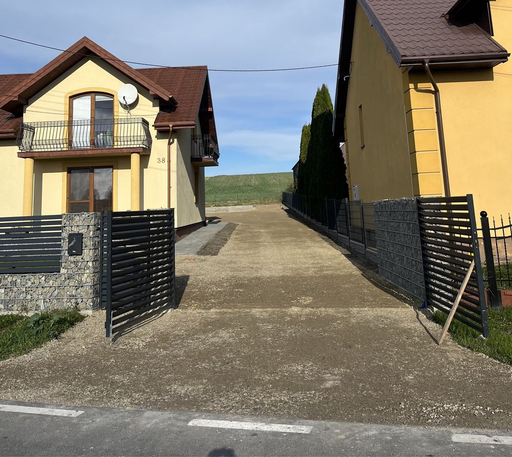 Budowa dróg dojazdowych, wjazdów, przepustów, układanie płyt drogowych
