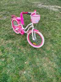 Rower dla dziewczynki intensywny różowy z frędzlami i koszykiem.