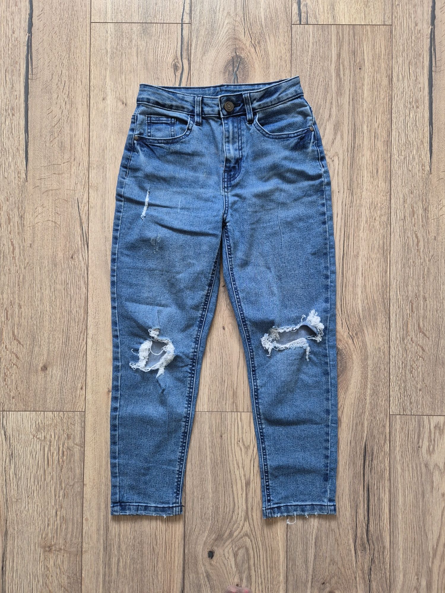 Spodnie jeansy dziury 146