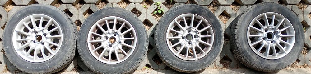 Koła opony letnie GOOD YEAR felgi ALU 14" śruby 4 x 100 piasta 56,2 mm