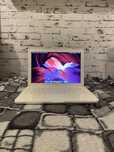 Apple Macbook A1342 z ładowarką