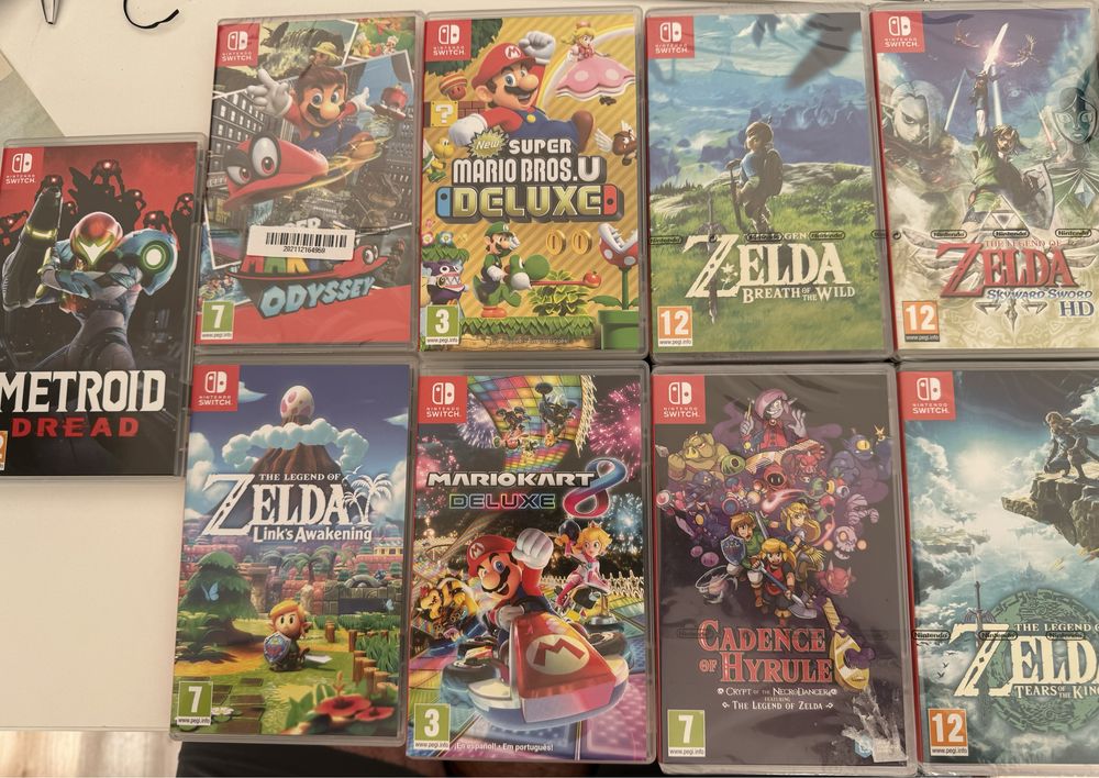 Nintendo Switch Oled + 2 comandos + 8 jogos