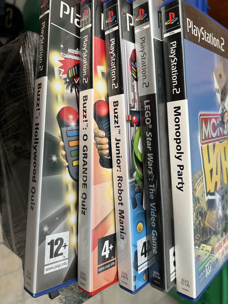 Playstation 2 com comandos e jogos