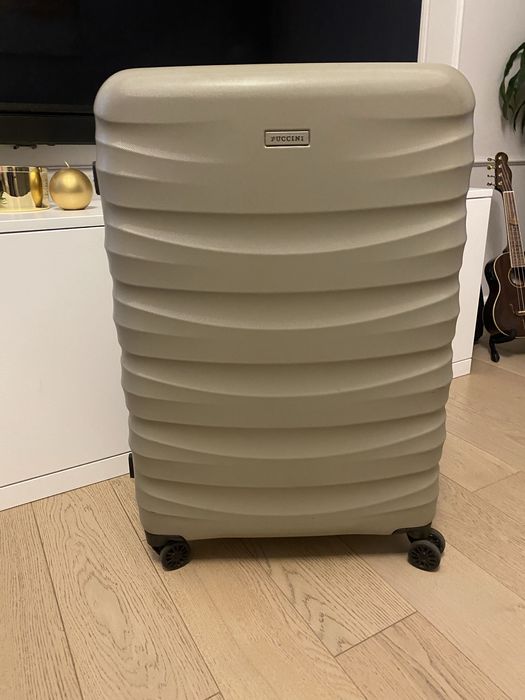 Duża walizka na kółkach Puccini z poliwęglanu beż / szampańska