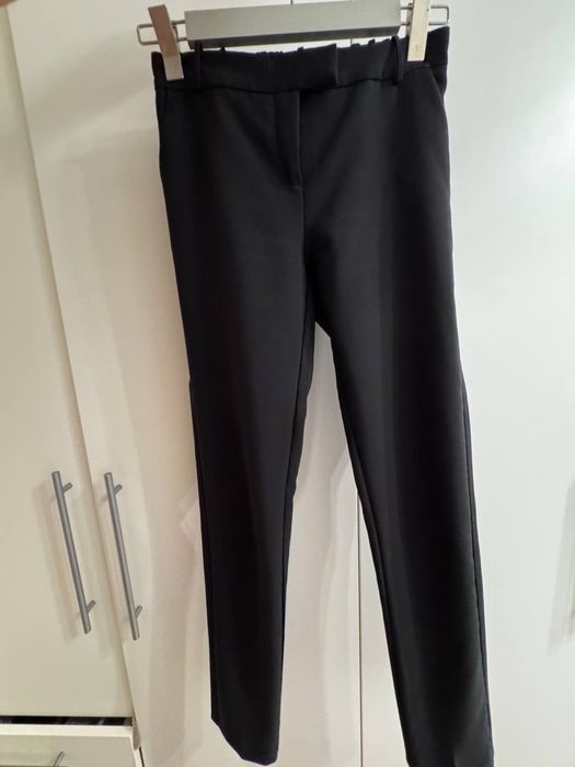 Женские брюки Imperial черного цвета , размера S
